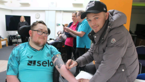 BREAKING NEWS: After visiting St. Oswald's Hospice, a Newcastle United fan from South Tyneside gets an autograph tattoo from Kieran Trippier.