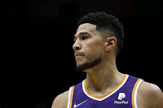 Breaking: Phoenix Suns Point Guard Devin Booker Will Not Be Reintegrated into the Team Lineup Due to Ongoing Concerns.